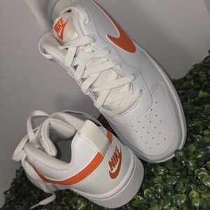 Nike Kids White Sneakers with Orange Swoosh